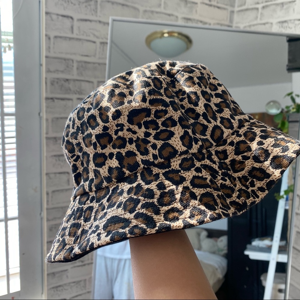 Reversible cheetah/black bucket hat